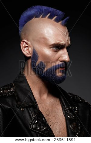 Young Man With Blue Hair And Creative Makeup And Hair.