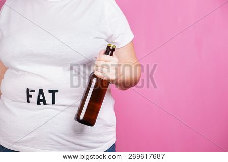Overeating, Excess Food, Glutton, Alcohol Addiction, Junk Food. Fat Obese Woman With Bottle Of Beer