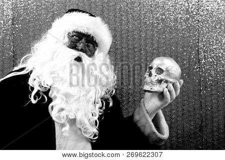 Santa Claus. Santa Preforms Shakespeare's Hamlet.  
Alas, poor Yorick! I knew him, Horatio, a fellow of infinite jest, of most excellent fancy. He hath borne me on his back a thousand times, and now,