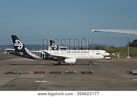 AUCKLAND AIRPORT, NEW ZEALAND - MARCH 2, 2016: Airliners of Air New Zealand at Auckland Airport with strong heat haze over the concrete surface