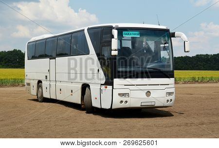 Ordering Intercity Bus, Standing On A Country Road. The Inscription On The Plate Behind The Glass 
