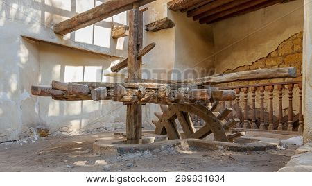 Cairo, Egypt - November 3 2018: Ancient Rotary Flour Mill Used To Be Rotated By Animal Power In Fron