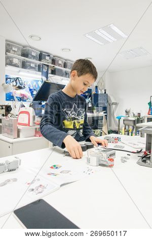 Vilnius, Lithuania - November 16, 2018: Kid Making Lego Robot Mindstorms. Robotic, Learning, Technol