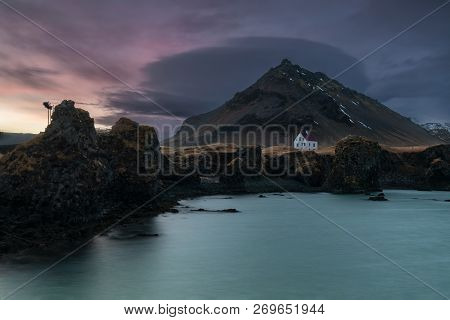 Sunset Over A Lonely House At Arnarstapi Harbor, Iceland