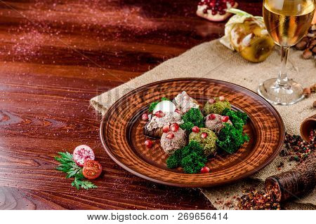 Georgian Dish - Phali Of Spinach And Meat On A Brown Plate On A Wooden Background. Close-up