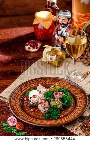 Georgian Dish - Phali Of Spinach And Meat On A Brown Plate On A Wooden Background. Close-up