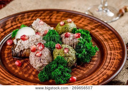 Georgian Dish - Phali Of Spinach And Meat On A Brown Plate On A Wooden Background. Close-up