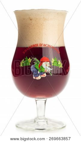 Groningen, Netherlands - November 16, 2018: Glass Of Belgian Cherry Chouffe Beer Isolated On A White