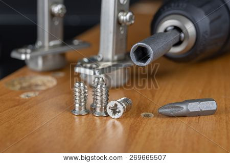 Installation Of Chipboard Furniture In A Carpentry Workshop. Accessories And Tools For Carpenters.