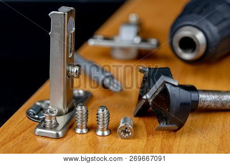 Installation Of Chipboard Furniture In A Carpentry Workshop. Accessories And Tools For Carpenters.