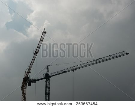 Construction Cranes In The Storm. Retiro Neighborhood, Buenos Aires, Argentina.