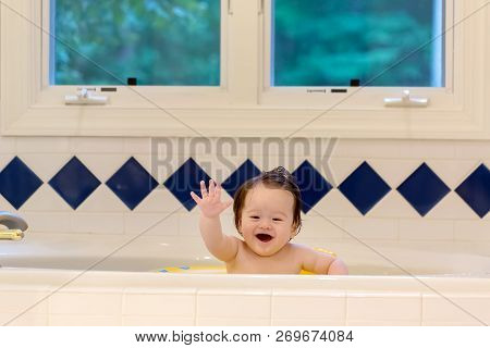 Baby Boy Taking A Bath In A Big Bath Tub