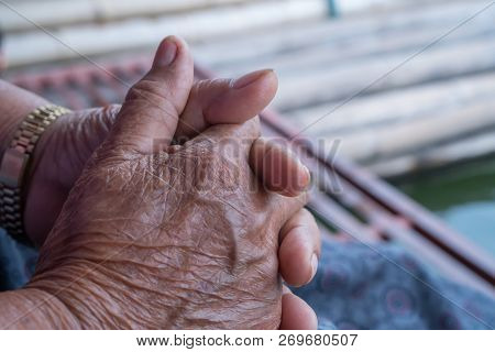 Hands Asian Elderly Woman Grasps Her Hand On Lap, Pair Of Elderly Wrinkled Hands In Prayer Sitting A