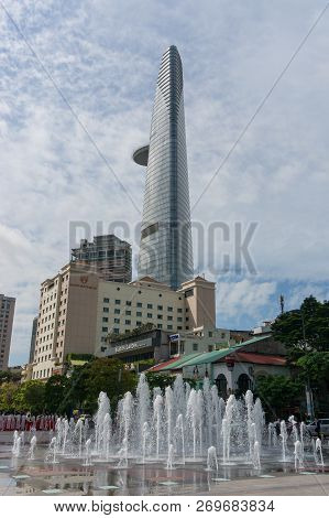 Ho Chi Minh City, Vietnam - August 24, 2017: Fountain On Nguyen Hue Boulevard With Saigon Skydeck To