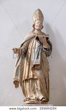 WURZBURG, GERMANY - JULY O4, 2018: Saint Burchard of Wurzburg, statue in Neumunster Collegiate Church in Wurzburg, Germany
