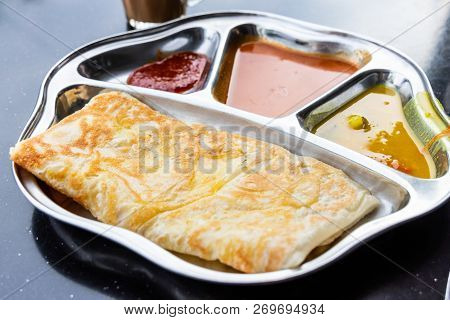 Roti Prata Or Canai Set With Curry, Dhal And Sambal