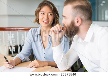 Confident Consultant Explaining Customer Document Details. Serious Boss Instructing Assistant Who Wr