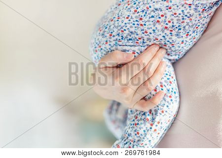 Mother Holding Little Baby On Hand In Bedroom. Mom Carrying Kid Indoor. Infant Child Sleeping On Mot
