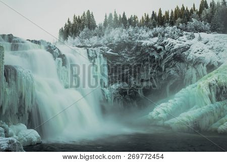 Biggest Frozen Swedish Waterfall Tannforsen In Winter Time