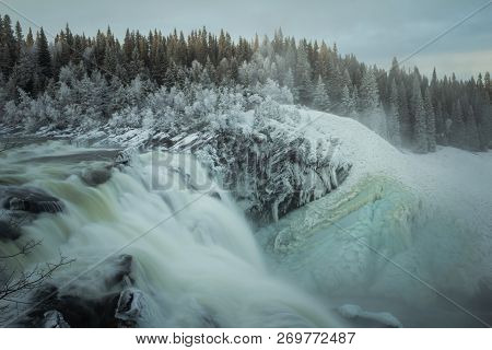 Biggest Frozen Swedish Waterfall Tannforsen In Winter Time