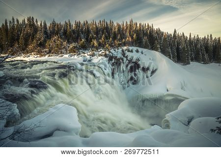 Biggest Frozen Swedish Waterfall Tannforsen In Winter Time