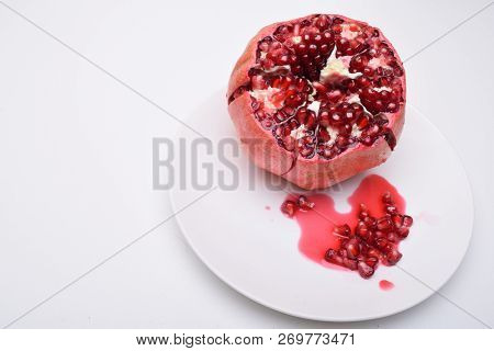 Pomegranate Punica Granatum Isolated On White Background. Pomegranates Are A Source Of Many Antioxid