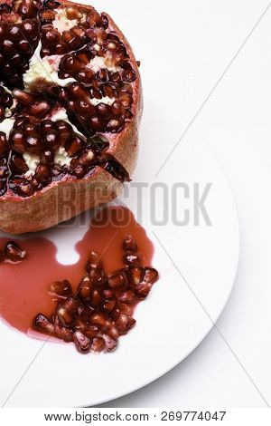 Ripe Juicy Pomegranate With A Drops And Seeds Heart Form, Juice. Macro