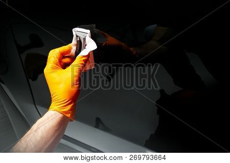 Car Polish Wax Worker Hands Polishing Car. Buffing And Polishing Vehicle. Car Detailing. Man Holds A