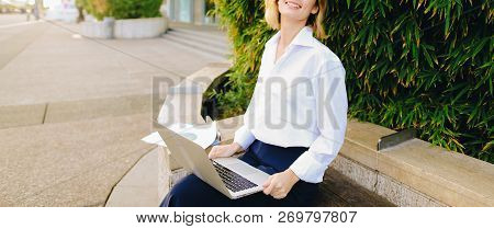 Statistician Working Outside With Laptop And Color Diagrams.