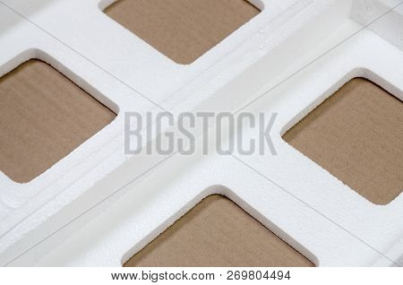 Background Image With Beige Cardboard Paper And Styrofoam Boxes Disgarded As Rubbish. The Concept Of