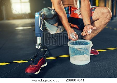 Sportsman With Prosthesis Working Out In Gym