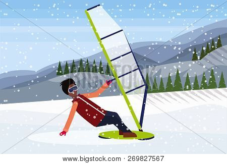 Man Windboarder Windsurfing On Snow Mountains Fir Tree Forest Landscape Background Extreme Sport Win