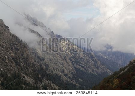 Mountains With Clouds In The Restonica Valley In Corsica