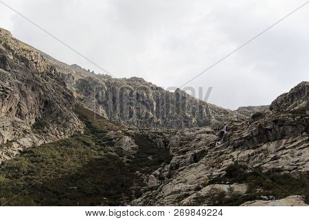 Mountains With Clouds In The Restonica Valley In Corsica