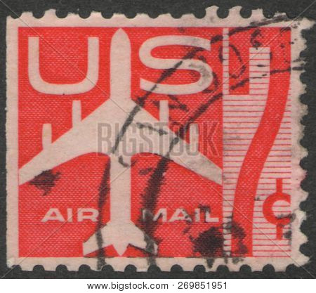Saint Petersburg, Russia - November 19, 2018: Postage Stamp Printed In Usa Shows A Jet Airliner, Cir