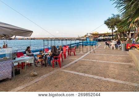 Sferracavallo, Sicily, Italy - October 1, 2018: Waterfront Promenade With People Enjoying The Outdoo