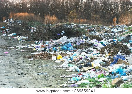 Pollution Of The Environment By People. A Pile Of Domestic Garbage In A Landfill In Bags. A Huge Pil