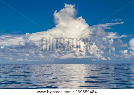 Calm Sea Ocean Blue Sky Background. Zen Background, Inspirational Sky Clouds Background. Natural Sun