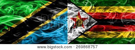 Tanzania Vs Zimbabwe, Zimbabwean Smoke Flags Placed Side By Side. Thick Colored Silky Smoke Flags Of