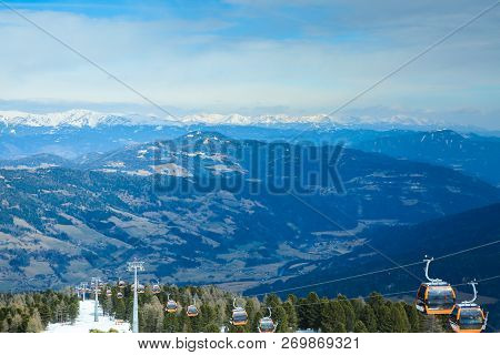 Orange Gondola Cabins Of Cableway Lift On Winter Snowy Mountains Background Beautiful Scenery
