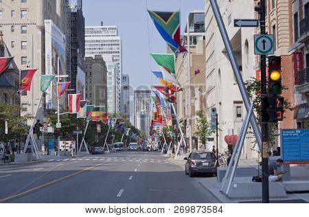 Montreal, Quebec, August 21, 2017 - Horizontal Looking Down Sherbrooke Street With International Fla