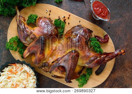 Whole Baked Flattened Chicken With A Golden Crispy Crust. 