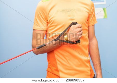 Shoulder Intrarotation With Elastic Performed By A Boy