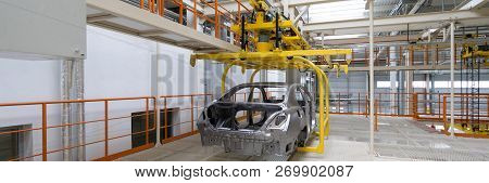 Body Of Car On Conveyor Close-up. Automotive Production Line. Long Format. Wide Frame