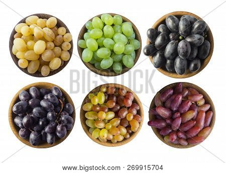 Grapes In A Wooden Bowl Isolated On White Background. Blue, Yellow, Red And Green Grapes On White Ba