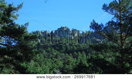 Crags Maliciosa Seen From A Trail In The Canyon. Navacerrada