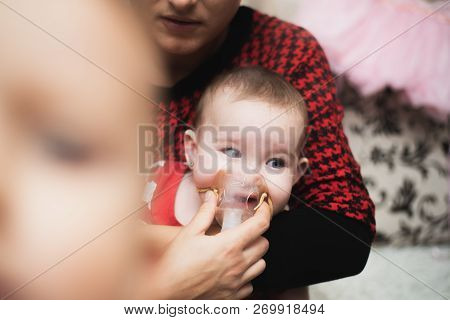 Mom Makes Inhalation Of The Child, Holding Hands