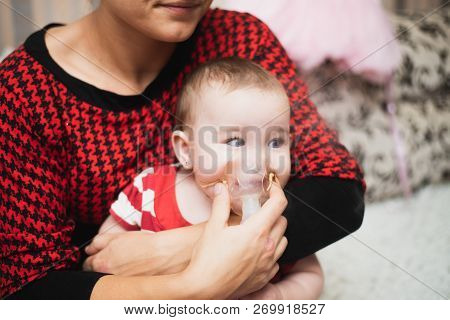 Mom Makes Inhalation Of The Child, Holding Hands