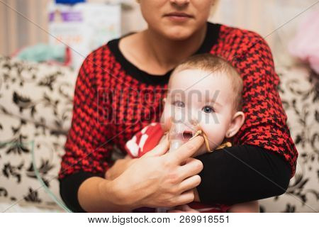 Mom Makes Inhalation Of The Child, Holding Hands