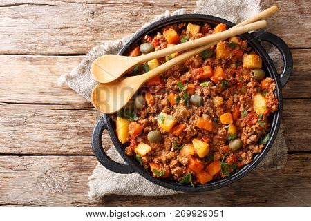 Delicious Picadillo Cooked From Ground Beef With Vegetables, Raisins And Spices Close-up In A Frying